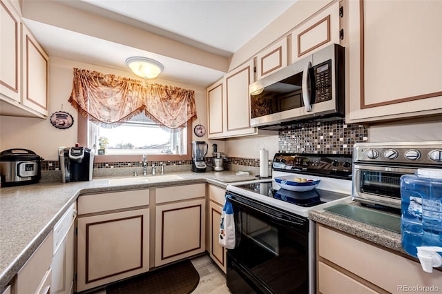 862 Centennial Way, Bennett, CO 80102 - kitchen with electric range oven, stainless steel microwave, a sink, dishwasher, and backsplash