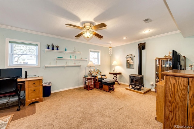 862 Centennial Way, Bennett, CO 80102 - home office featuring a ceiling fan, a wood stove, light colored carpet, baseboards, and crown molding