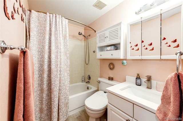 862 Centennial Way, Bennett, CO 80102 - full bath featuring toilet, shower / tub combo, vanity, and wood finished floors
