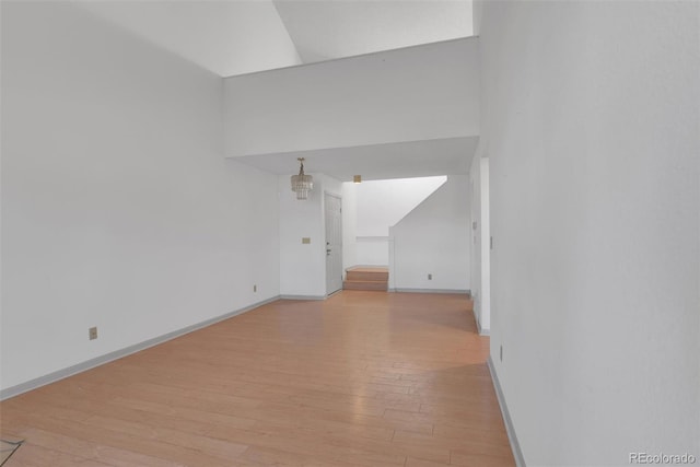 empty room featuring light wood-style flooring and baseboards