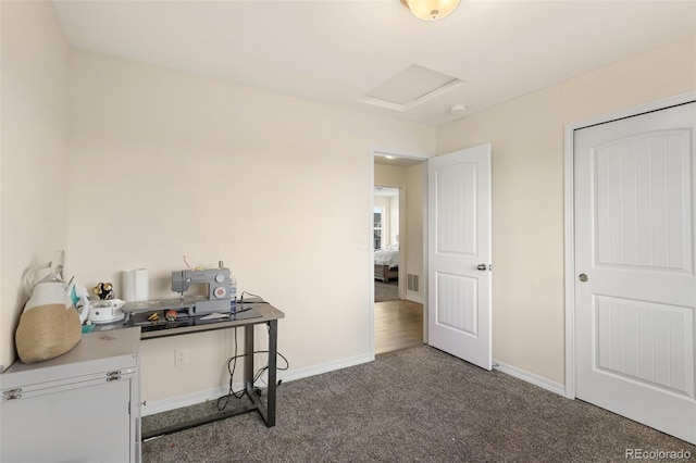 carpeted home office with visible vents, attic access, and baseboards