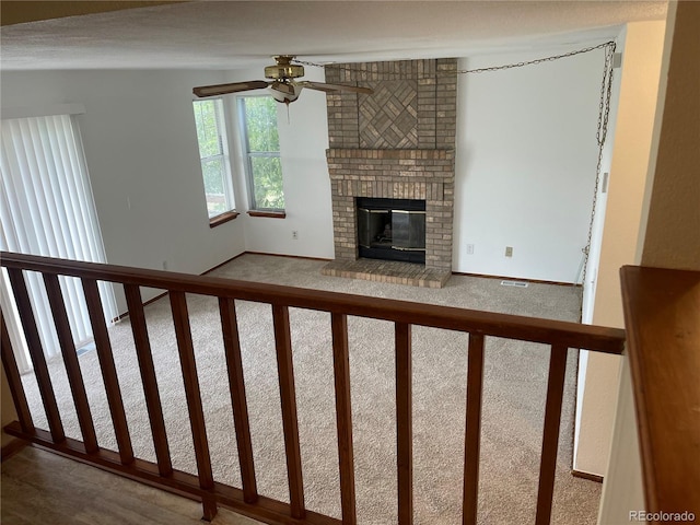4812 S Bahama Way, Aurora, CO 80015 - unfurnished living room with a ceiling fan, a fireplace, and baseboards