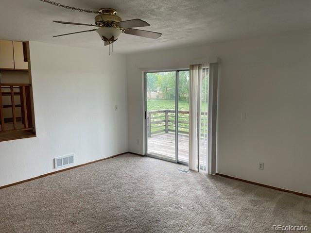 4812 S Bahama Way, Aurora, CO 80015 - empty room featuring light carpet, a ceiling fan, and baseboards