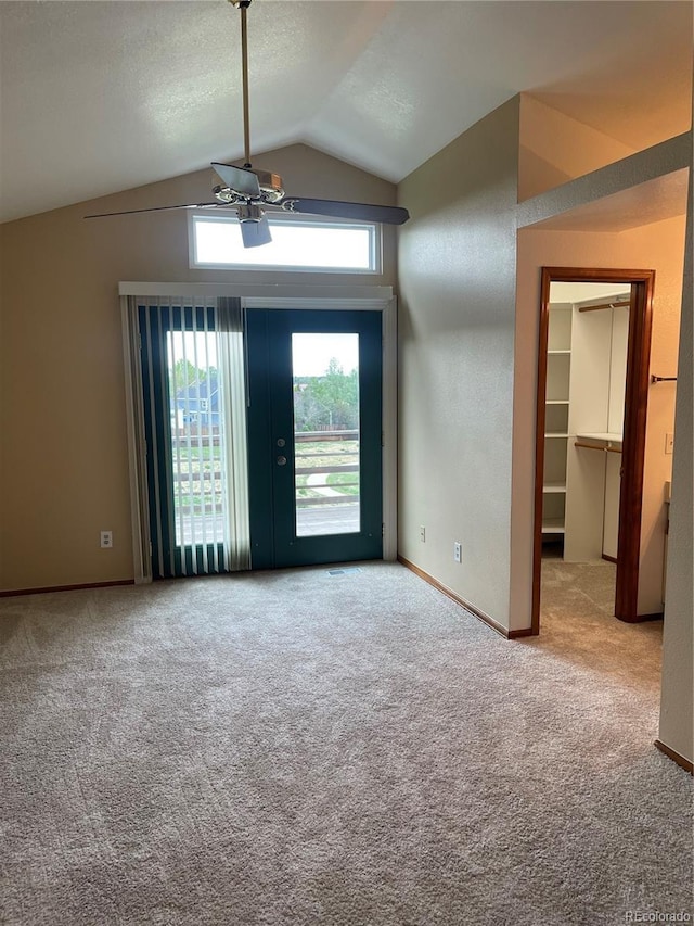 4812 S Bahama Way, Aurora, CO 80015 - unfurnished living room featuring ceiling fan, carpet flooring, vaulted ceiling, and baseboards