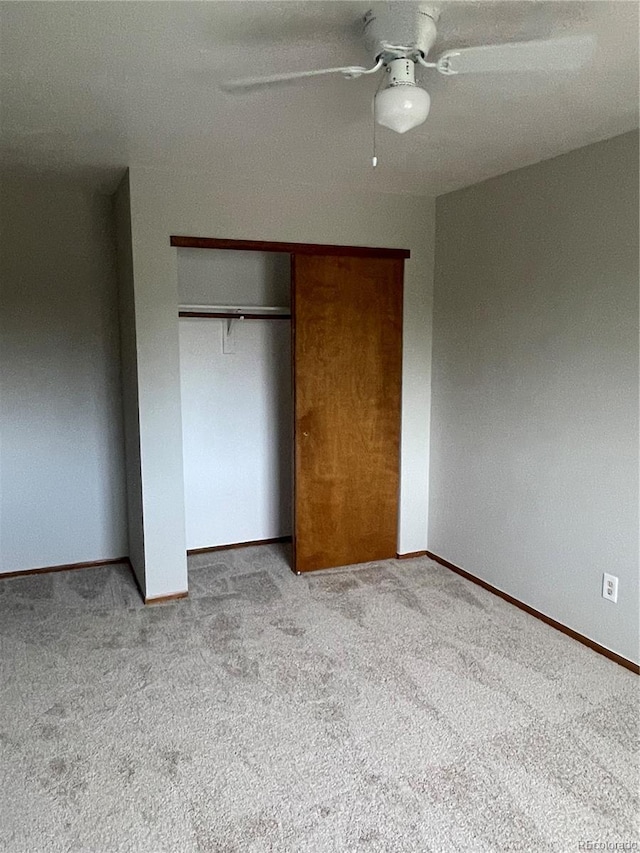 4812 S Bahama Way, Aurora, CO 80015 - unfurnished bedroom with light carpet, a closet, baseboards, and a ceiling fan