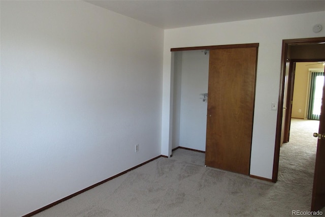 4812 S Bahama Way, Aurora, CO 80015 - unfurnished bedroom with light carpet, a closet, and baseboards