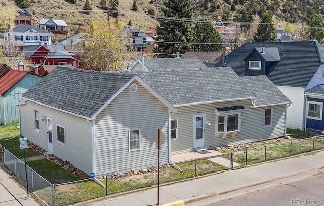 1104 Miner St, Idaho Springs, CO 80452 - view of front of home featuring a fenced backyard and a residential view
