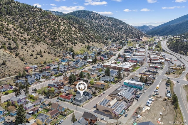 1104 Miner St, Idaho Springs, CO 80452 - aerial view of property and surrounding area with mountains and nearby suburban area