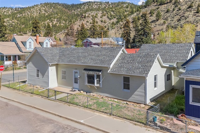 1104 Miner St, Idaho Springs, CO 80452 - view of front facade featuring a mountain view and a shingled roof