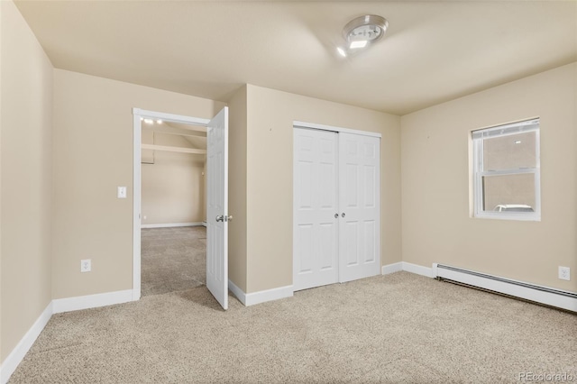 1104 Miner St, Idaho Springs, CO 80452 - unfurnished bedroom with carpet floors, baseboard heating, baseboards, and a closet