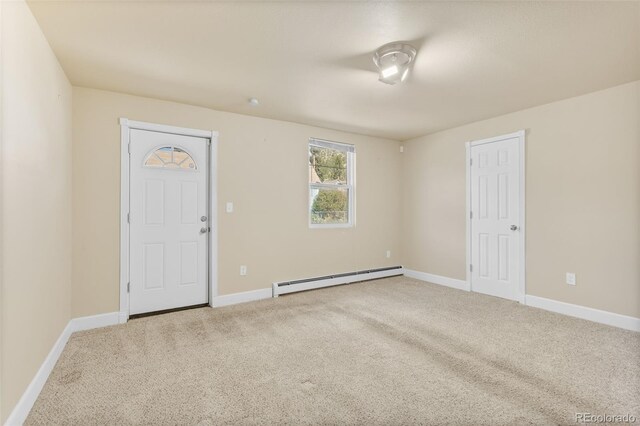 1104 Miner St, Idaho Springs, CO 80452 - carpeted spare room with a baseboard heating unit and baseboards