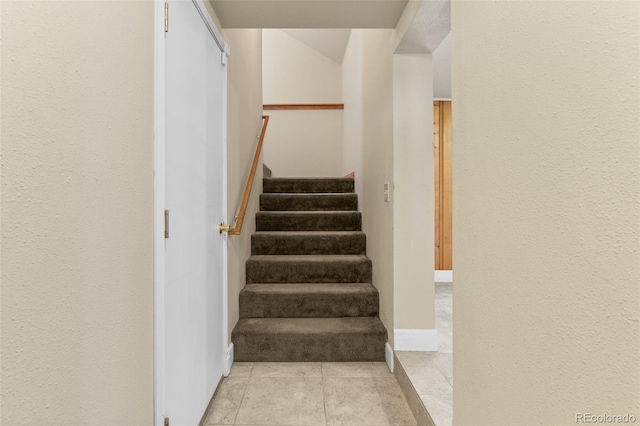 1104 Miner St, Idaho Springs, CO 80452 - stairs featuring tile patterned floors and baseboards