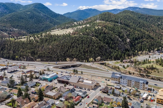 1104 Miner St, Idaho Springs, CO 80452 - drone / aerial view of a mountainous background and a heavily wooded area