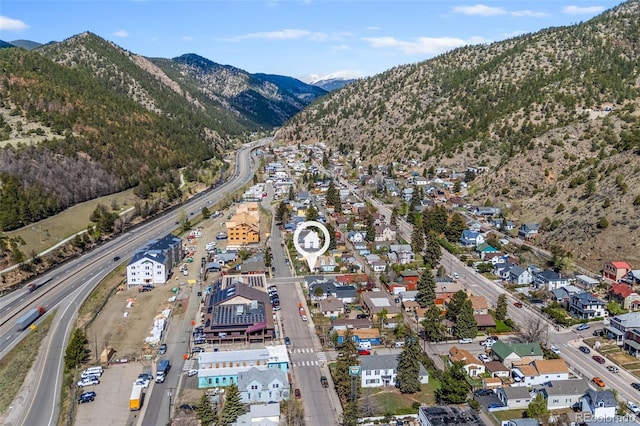 1104 Miner St, Idaho Springs, CO 80452 - aerial view of property and surrounding area with a mountainous background, a major roadway, and nearby suburban area