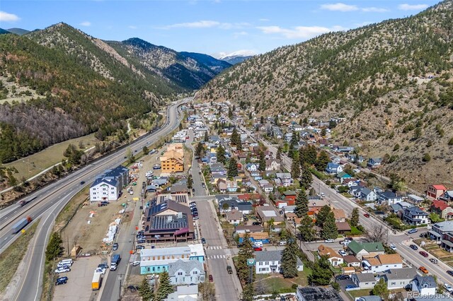 1104 Miner St, Idaho Springs, CO 80452 - view of property location with a mountain backdrop, a major roadway, and nearby suburban area
