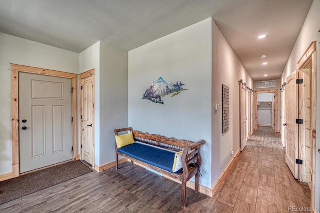 11398 County Road 302, Buena Vista, CO 81211 - entryway featuring wood finished floors, recessed lighting, and a barn door