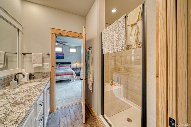 11398 County Road 302, Buena Vista, CO 81211 - full bathroom with ensuite bathroom, vanity, a shower stall, and wood finished floors