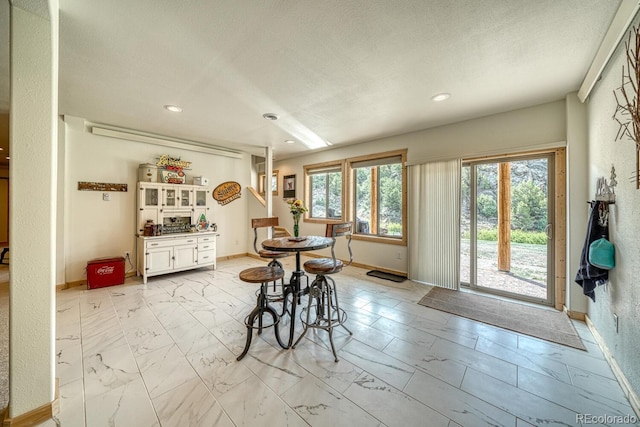 11398 County Road 302, Buena Vista, CO 81211 - dining room with light marble finish flooring, recessed lighting, and a textured ceiling