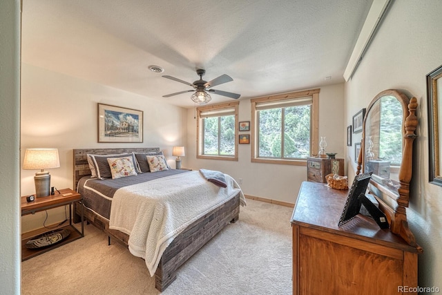 11398 County Road 302, Buena Vista, CO 81211 - bedroom with light carpet, a ceiling fan, and a textured ceiling