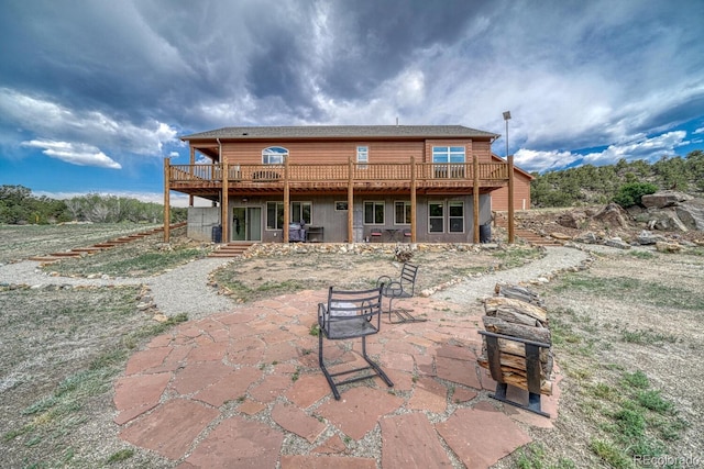 11398 County Road 302, Buena Vista, CO 81211 - rear view of house featuring a wooden deck and a patio