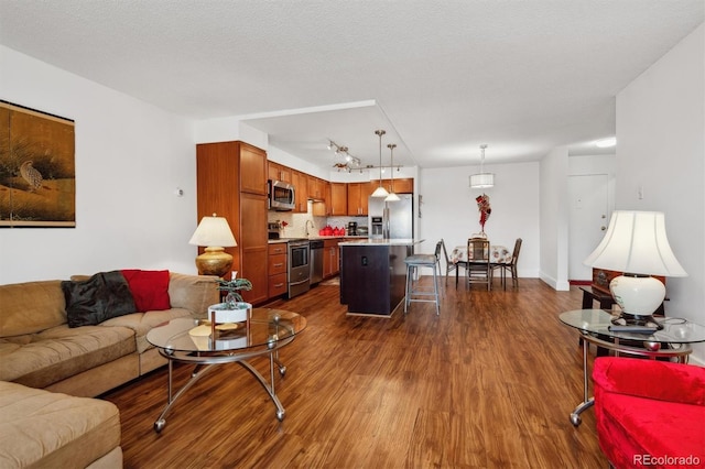 living area featuring dark wood-style floors