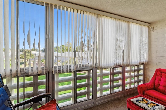 sunroom / solarium with a textured ceiling