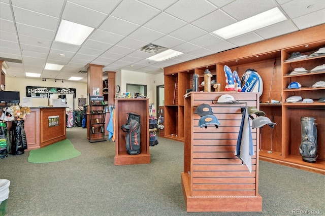 interior space with carpet floors, stairway, a drop ceiling, and visible vents