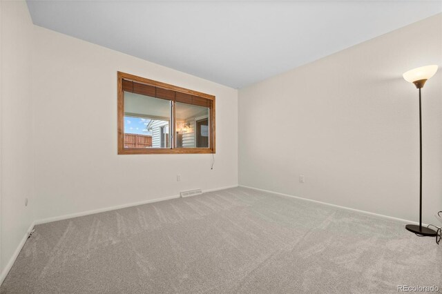 7483 W Cedar Cir, Lakewood, CO 80226 - carpeted empty room with baseboards