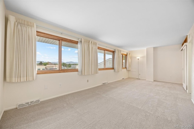 7483 W Cedar Cir, Lakewood, CO 80226 - spare room featuring carpet floors and baseboards
