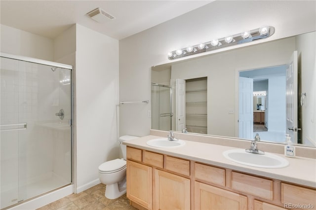 full bath with a shower stall, visible vents, and a sink