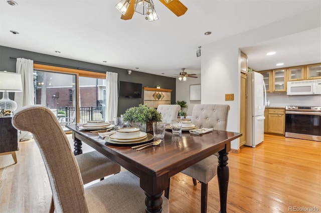 dining space featuring a ceiling fan, recessed lighting, and light wood-style floors