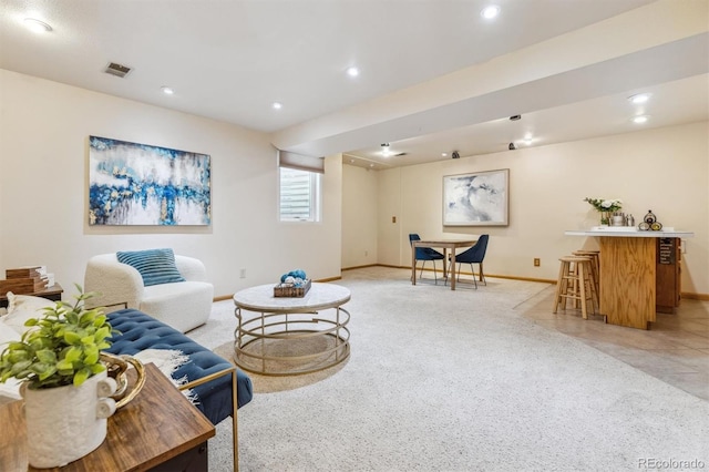 living area featuring visible vents, recessed lighting, and baseboards