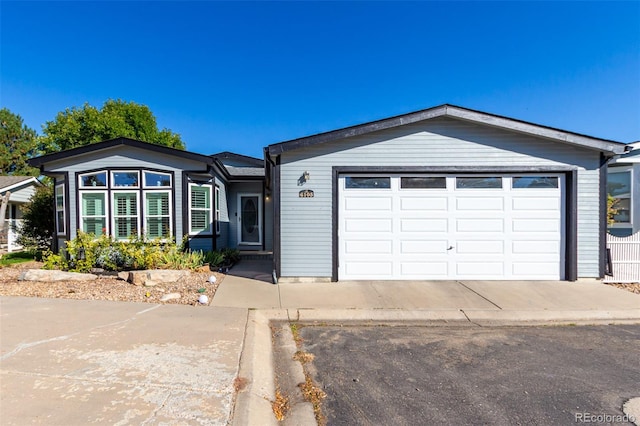 single story home with a garage