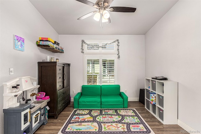 game room featuring ceiling fan and dark hardwood / wood-style floors