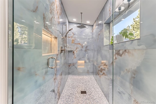 full bathroom featuring a marble finish shower