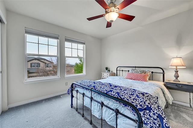 bedroom with carpet floors, baseboards, a ceiling fan, and visible vents