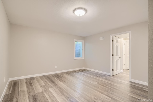 3401 W Milan Ave, Denver, CO 80236 - spare room featuring light wood-style floors and baseboards