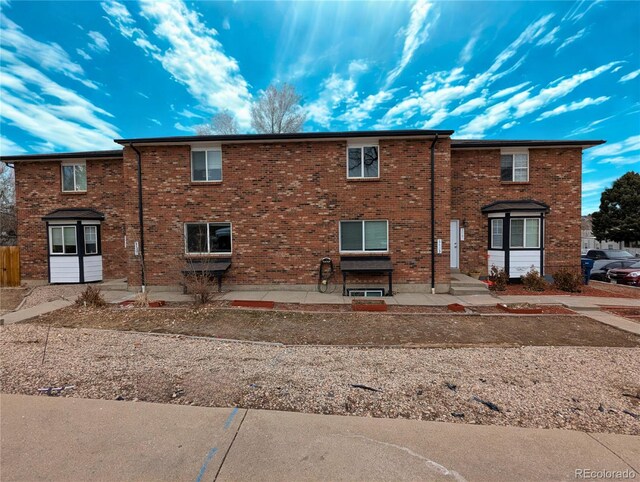 3401 W Milan Ave, Denver, CO 80236 - back of property with brick siding and a patio area