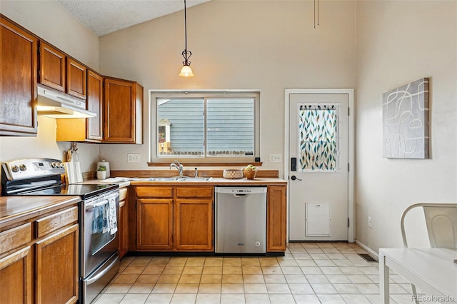 kitchen featuring a sink, appliances with stainless steel finishes, under cabinet range hood, and high vaulted ceiling