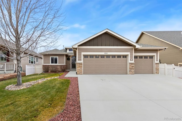 view of front of home with a garage and a front lawn