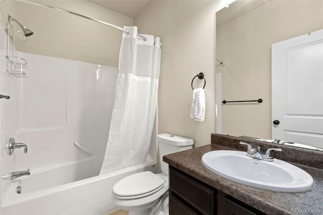 full bathroom featuring shower / bath combination with curtain, vanity, and toilet