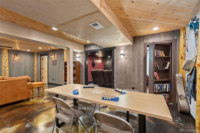 dining space with wooden walls and wood ceiling