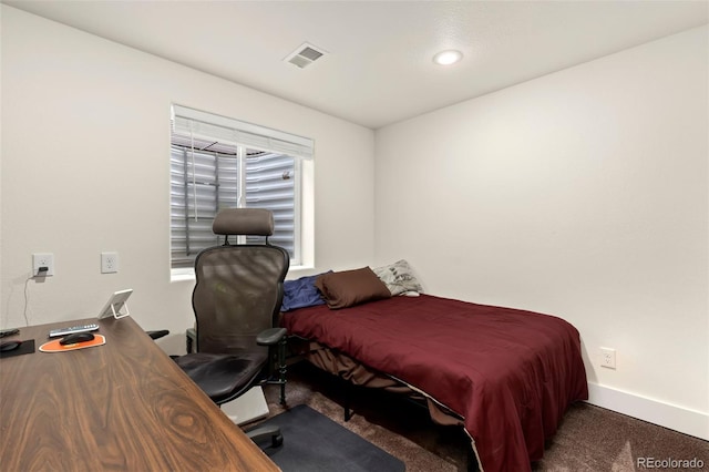 carpeted bedroom featuring multiple windows