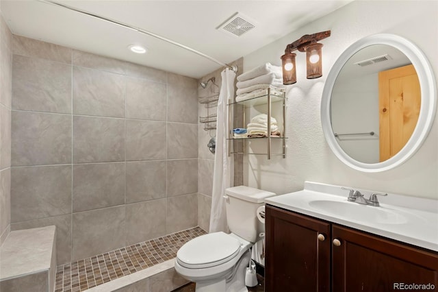 bathroom with vanity, toilet, and walk in shower