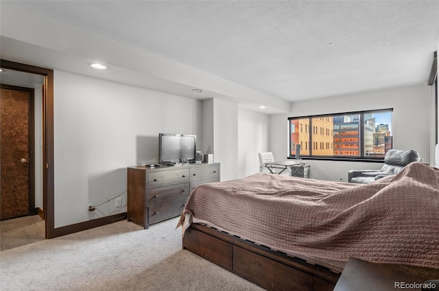 bedroom featuring light colored carpet