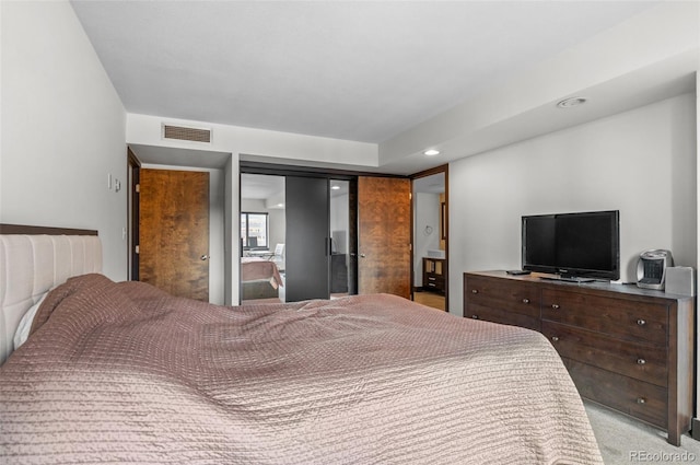 bedroom with light colored carpet