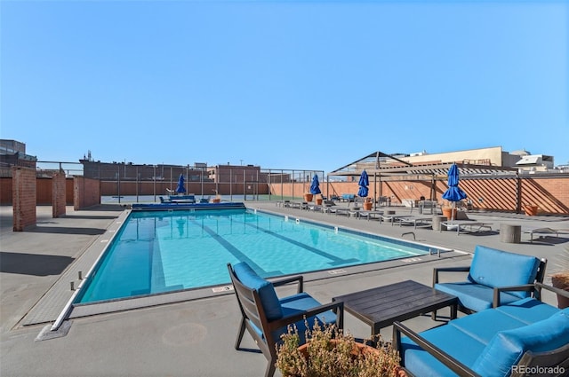 view of swimming pool featuring a patio area