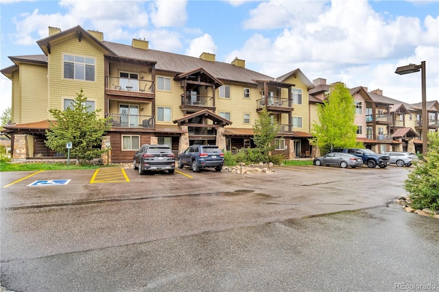 801 Trailhead Cir Unit 812, Winter Park, CO 80482 - view of building exterior with uncovered parking and a residential view