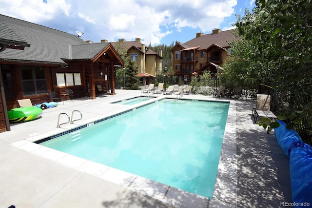 801 Trailhead Cir Unit 812, Winter Park, CO 80482 - community pool with a hot tub, a patio area, and a residential view