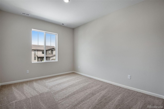 spare room featuring carpet flooring